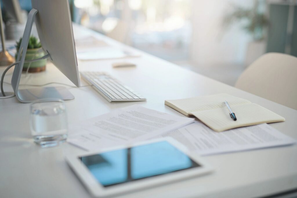 Shot of various items on a desk in an empty modern office